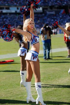 the cheerleaders perform for the crowd at a football game in their white boots