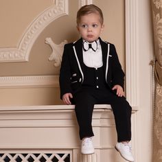 The Adam is the latest Itty Bitty Toes design for young boys. It features a luxurious black jacket fastens with white buttons and has a matching black pocket to match the double-layered bow tie. The black trousers have an elasticated waistband for uttermost comfort. This classic black and white suit is classic and timeless, perfect for any special occasion, and will never go out of style. It is made with as much attention to detail and luxurious fabrics as gentlemen's suits. ⦁ Suit jacket, vest, Black And White Suit, Black And White Tuxedo, Tuxedo Mask, Bearer Outfit, Ring Bearer Outfit, White Tuxedo, Suspenders Set, Tuxedo Style, Black Vest