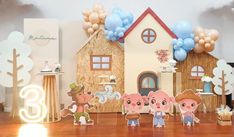 a group of paper cut outs standing in front of a house with balloons on it