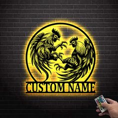 a person holding up a game controller in front of a brick wall with the word custom name on it