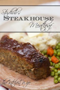 meatloaf with mashed potatoes, peas and carrots on a white plate