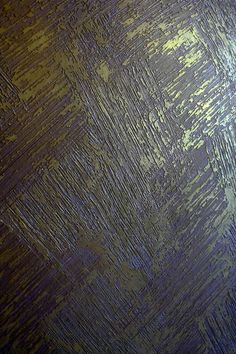 an image of a textured surface that looks like it has been painted gold and blue