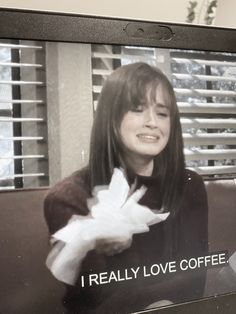 a woman holding a white dove in front of her face with the words i really love coffee on it