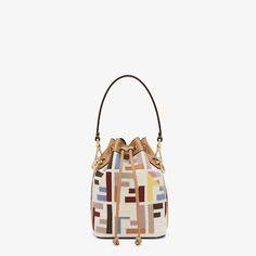 Iconic Mon Tresor bucket bag, distinguished by a timeless, compact and spacious silhouette. Made of natural-colour canvas with a raised FF motif embroidered in multicolour yarn. Embellished with cappuccino-coloured leather details. Lined and with gold-finish metalware. The double handle and adjustable and detachable shoulder strap for carrying the bag by hand on the shoulder or cross-body. Holds a 6.7-inch smartphone, Mini Trifold card holder or wallet, keys and lipstick. Made in Italy. One Size Multicolor Yarn, Clutch Pouch, Colored Leather, The Double, Cappuccino, Mini Bag, Cross Body, Bucket Bag, Metallica