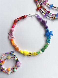 "🍧🌈Rainbow Sherbet Necklace🌈🍧 FREE SHIPPING You will receive one necklace like those similar to pictures. Bead pattern will be a rainbow of color. Made to order and beaded by me with luvvv <3 Strung on strong cord with a mixture of bright, random, and fun beads similar to picture. Lobster clasp closure. Each necklace is unique and no necklace looks exactly alike. NECKLACE LENGTH OPTIONS Option 1 💓 14\" Option 2 🌟 16\" Choose your desired length before purchase 🍧 (if no length is chosen Playful Rainbow Jewelry For Festivals, Rainbow Letter Beads For Festival, Playful Rainbow Beaded Necklaces With Letter Beads, Trendy Handmade Rainbow Beaded Necklaces, Rainbow Heart Beads For Jewelry Making, Playful Rainbow Letter Beads Necklace, Fun Rainbow Necklaces With Colorful Beads, Rainbow Beaded Necklace With Heart Beads, Rainbow Heart Beads Necklace