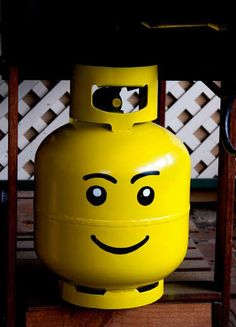 a large yellow barrel with a smiley face on it