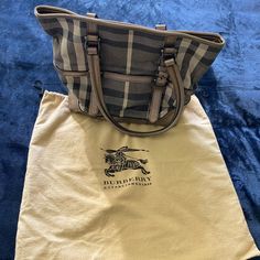 This Listing Is For One Authentic Burberry Pewter Leather And Sparkle Canvas, Exploded Nova Check Handbag Tote And One Genuine, Original Dust Bag. It Is In Very Good To Excellent Used Condition. Interior Is Extremely Clean; Leather Has Been Well Kept And Still Very Soft. No Snags On The Canvas And Normal Wear Through Out (Scratches To Bottom Hardware, Etc). There Is Ons Stain/Discoloration Mark On One Side Of Tote - Needs To Be Professionally Cleaned. Thank You For Looking! Q’s? Let Me Know! Mini Hand Bag, Burberry Tote, Burberry Classic, Vinyl Bag, Burberry Vintage, Vintage Burberry, Black Leather Tote, Nylon Tote, Black Leather Handbags