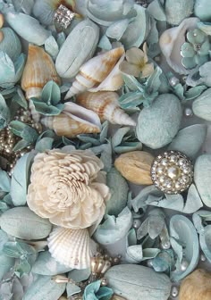 sea glass and seashells are mixed together to create an artistic background for this photo