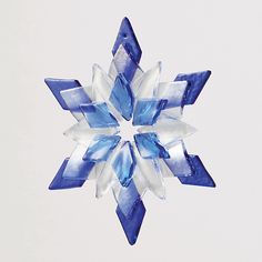 a blue and white snowflake is shown against a white background with no clouds