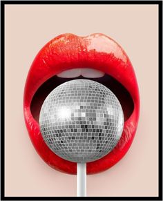 a mirror ball in the mouth of a woman's lips and tongue with red lipstick