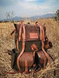 Materials ▪️ 100% cotton, water resistant waxed canvas and Genuine Leather ▫️Wide and deep flasks on the right and left ▪️550 Lb parachute rope as tension straps on the flask ▫️Leather hanger for hanging knives and axes on both sides ▪️Two front pockets ▫️Axe hanger with buckle between front pockets ▪️ Foam padded shoulder straps and back ▫️Hip Belt: By giving some of the weight from the shoulders to the hip bone, it prevents the shoulders from getting sore in a short time and provides a more co Rugged Outdoor Backpack With Waxed Finish, Rugged Canvas Backpack For Outdoor, Rugged Adventure Bag With Pockets, Canvas Backpack With Pockets For Outdoor, Functional Waxed Leather Backpack For Outdoor, Practical Waxed Canvas Backpack For Outdoor, Practical Outdoor Waxed Canvas Backpack, Practical Waxed Canvas Outdoor Backpack, Rugged Bag With Waxed Finish For Outdoor Activities