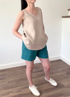 Natural eco-friendly loose washed linen tank top for women's. Made with love for You. *100% local medium weight linen *Breathable tissue *Each item is individually cut and sewn by order *The model is wearing size M, top color - beige *The model is height is 168 cm *The length from shoulder to hem 65 cm *Note that colors may look different on your display depending on their settings and technical characteristics. Please let us know if you need different measurements or colors. CARE: *Machine wash Sleeveless Linen Shirt, Casual Linen Tank Vest, Summer Beach Linen Vest, Casual Flax Linen Tank Top, Casual Linen Beach Vest, Flax Sleeveless Top For Spring, Casual Linen Vest Top, Casual Sleeveless Flax Tank Top, Sleeveless Flax Tops For Spring