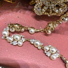 "Brilliant pearl crystal rhinestone trimming made with high quality rhinestones and ivory white pearls set on metal setting. Perfect for wedding or formal occasions. For best application, hand-sewing is recommended. Item Code: PRL-04 Width: 1/2\" Sold by the yard (1 yard = 36 inches) All items are available to ship from our NYC store. We ship both US and International. No returns or exchanges." White Pearl Jewelry With Rhinestones, Elegant Metal Bridal Necklace With Rhinestones, Bridal Metal Necklace With Rhinestones For Wedding, Metal Bridal Necklace With Rhinestones For Wedding, Elegant Wedding Rhinestone Metal Necklace, Glamorous Metal Bridal Necklace For Weddings, White Metal Bridal Necklace For Wedding, White Rhinestone Necklace With Pearl Chain For Wedding, Elegant Rhinestone Necklace With Pearl Chain