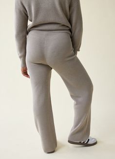 Let’s get cozy. These laid-back maternity pants feature drapey wide legs and the softest, snuggliest sweater knit you’ve ever felt. Done with a mid-rise, elastic waist that stretches with your bump without digging in, these pants are the kind of comfy you’ll never want to take off. Top with the matching Cozy Quarter Zip Sweater or your favorite blouses or button-ups — they can be dressed up or down.  Ribbed sweater knit: mid-weight and super comfortable  Stretch level: high  50% polyester, 50% acrylic  Machine was cold, gentle cycle. Wash inside out and separately. Reshape and dry flat in shade. Cool iron if needed. Do not bleach or dry clean. Fits from 1st to 4th trimester  Mid-rise covered elastic waistband  Wide-leg fit (inseam: 28 ¼”)  Works on sizes 0 to 18  We recommend choosing your Work Baby Showers, Compression Wear, Cozy Knit Sweater, Essential Dress, Baby Shower Dresses, Photoshoot Dress, Quarter Zip Sweater, Shower Dresses, Nursing Tops