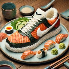 a plate with sushi on it and some chopsticks next to it,