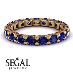 Show off luxury, elegance, and style with this fascinating Glamorous Sapphire Eternity Ring. This Glamorous Sapphire Eternity Ring is a charming band, which is made up of a wide band with a row of round shaped stones covering it. Not to mention how comfortable it is. For turning heads and impressing everyone, this Glamorous Sapphire Eternity Ring is just what you need. Stock Number: 5955 Metal Setting Metal Type: 14K Yellow Gold Main Stone Additional Stones Stone Type: 100% Natural Blue Sapphire Halo Engagement Ring Emerald, Sapphire Eternity Ring, Vintage Engagement Rings Sapphire, Green Emerald Ring, Deco Engagement Ring, Art Deco Engagement Ring, Blue Sapphire Rings, Natural Blue Sapphire, Elegant Ring