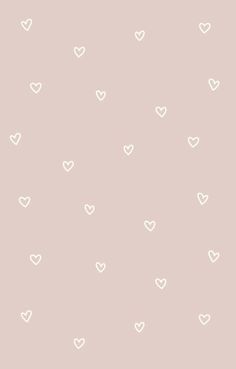 a pink wall with white hearts on it