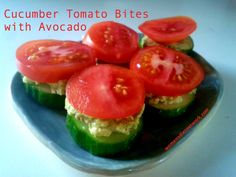 cucumber tomato bites with avocado on a blue plate, ready to be eaten