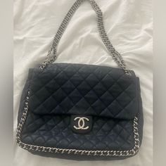 Chanel Maxi Chain Around Flap Bag. Incl. Original Chanel Dust Bag, Authenticity Card Navy Blue Lamb Skin, Interlocking Cc Logo, Quilted Pattern. Silver Tone Hardware. Chain Link Shoulder Strap. Gross Grain Lining & Three Interior Pockets. Snap Closure. Shoulder Strap Drop 13”, Height 10” Width 13.5 Depth 4” Item Exterior Excellent/Pristine/Gently Carried. Interior Moderate Marks See Pics. **Rare To Find This Bag In This Excellent Condition. Bag Is Highly Coveted From The Cruise 2013 Collection By Karl Lagerfeld . Chanel Maxi, Chanel Jumbo, Bag With Chain, Quilted Pattern, Cc Logo, Flap Bag, Chanel Bag, Karl Lagerfeld, Chain Link