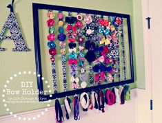 a wall hanging made out of different types of hair clips and buttons with the word diy bow holder on it