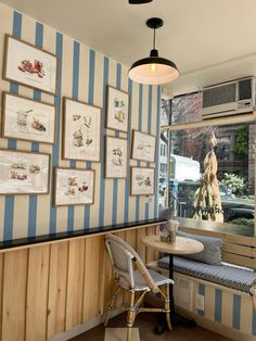 a restaurant with blue and white striped walls