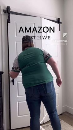 a woman standing in front of a white door with the words amazon on it's back