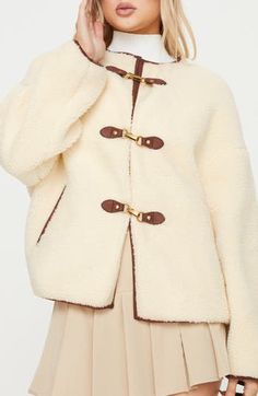 Faux shearling gives teddy-bear-inspired texture to this relaxed-fit coat with handy pockets to hold your essentials. Clasps at front Jewel neck Side-seam pockets Lined 100% polyester faux fur Hand wash, dry flat Imported Faux Shearling Coat, Festival Jacket, Fluffy Jacket, Fitted Coat, Stylish Coat, Teddy Coat, Sweatshirt Set, Fall Coat, Shearling Coat