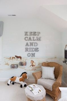 a child's bedroom decorated in white and brown