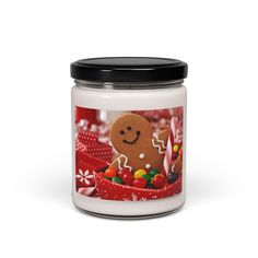 a candle with a gingerbread cookie on it