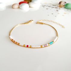 Minimalist, wearable, and delicate 24k gold plated Miyuki multicolored beads bracelet. Length: from 5,5" (14 cm) to 8" (20 cm) with 1" (2.5 cm) 14k gold-filled extensor chain. Width: 24k gold plated 2.2 mm Miyuki beads. Materials: 14k gold filled clasps, rings and chain. Handmade in Spain. Ombre Jewelry, Beaded Chain Bracelet, Delicate Gold Bracelet, White Jewellery, Mini Bracelet, Miyuki Bracelet, Simple Bracelets, Miyuki Beads, White Jewelry