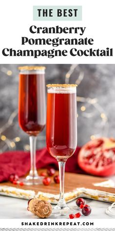 two glasses filled with cranberry pomegranate champagne cocktail on top of a table