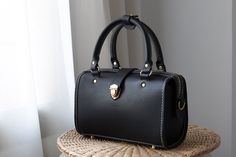 "Product Description * Material:vegetable tanned leather * Color: black * Open compartment with double zips closure  * Leather Top Handles * 0.62\" wide leather shoulder strap adjust from 36.61\" to 44.88\" * Two inside open pockets * Sewn by hand; * Size: 170mm (H) x 260mm (W) x 120mm (D) / 6.6\" x 10.2\" x 4.7\" The Installation of Doctor Bag Frame #Please see the last picture# Doctor Bag Frame is connected by two pairs of screws. Although we will tighten the screws before the delivery, due to Elegant Satchel With Leather Handles For Gift, Handmade Luxury Satchel For Everyday, Handmade Box Bag For Everyday Use, Luxury Handmade Satchel For Everyday, Handmade Everyday Box Bag, Luxury Handmade Shoulder Bag For Everyday, Handmade Elegant Crossbody Satchel, Elegant Handmade Crossbody Satchel, Elegant Everyday Handmade Shoulder Bag