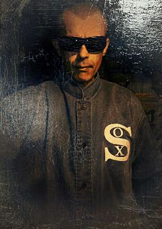 a man wearing sunglasses and a baseball uniform with the letter s on it's chest