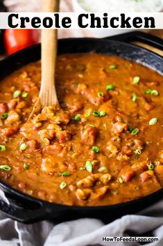 a skillet filled with chicken chili and garnished with green onions