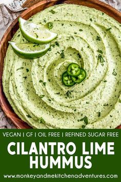 a bowl filled with cilantro lime hummus