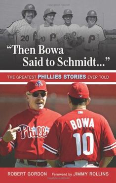 there are two baseball players on the cover of their book, they both have red uniforms