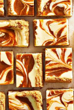 there are many squares of brown and white swirled cake