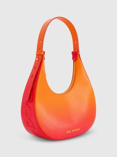 Add a pop of color to any look with our bold Ombre Leather Hobo Bag. Its trendy ombre design and convenient size seamlessly blends fashion and functionality, making it the perfect accessory for any occasion. Mac Duggal Leather Construction 24k Gold-plated hardware Two interior pockets Zipper closure Chic top handle with 9"in adjustable shoulder strap Medium size: W 11.8 in x H 11.0 in x D 3.5 in (metric: 30cm X 28cm X 9cm) Fits up to: iPhone 14, Airpods, Wallet, and Lipstick Available in Sunset Orange Shoulder Bag, Orange Bags, Ombre Bag, Sunset Ombre, Trendy Bags, Ombre Design, Ombre Fashion, Hobo Shoulder Bag, Western Chic