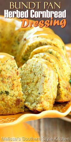 a bundt pan filled with cornbread dressing on top of a yellow platter