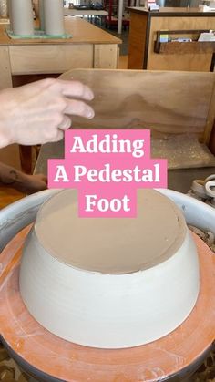 someone is adding a pedestal foot to a cake