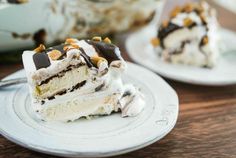 a piece of cake sitting on top of a white plate next to another slice of cake