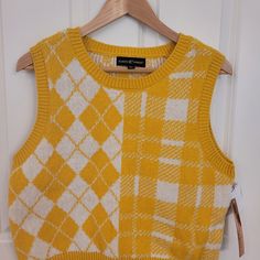 Almost Famous Sleeveless Sweater. Mustard Yellow & White. Size Xl Ptp 19.5". Shoulder To Bottom Hem 20". Smoke Free & Dog Friendly Home. Fitted Mustard Sleeveless Top, Mustard Fitted Sleeveless Top, Trendy Yellow Spring Vest, Yellow Sleeveless Sweater Vest For Spring, Sleeveless Yellow Sweater Vest For Fall, Yellow Sleeveless Vest For Fall, Yellow Cotton Vest Top, Casual Yellow Cotton Sweater Vest, Trendy Yellow Vest Top