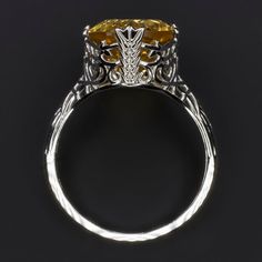 This beautiful and unique solitaire ring features a 4.75ct oval cut citrine set in a classically elegant vintage style design that will never go out of style! Measuring approximately 12mm across, the citrine has a substantial look and a gorgeous sunny yellow hue. Utterly classic and romantic, the antique style setting is richly textured with intricate engraving and graceful filigree. The effect is chic but also dreamy and softly feminine, a perfect choice for a timeless gift or a treat for yours Luxury Hallmarked Yellow Gold Filigree Ring, Elegant Backdrop, Red Tourmaline, Diamond Engagement Ring Set, Natural Diamond Engagement Ring, Sunny Yellow, Yellow Citrine, Timeless Gifts, Bright Purple