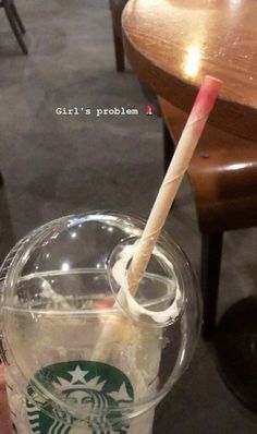 a starbucks drink with a straw sticking out of it