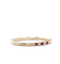 -Dainty solid gold band in the picture is set with 3 ruby and 2 white diamond in a micropave set. -This band measures approximately 1.30mm thickness in full round. -1mm white fine quality diamonds ( Color:F, Clarity:VS ,CONFLICT-FREE) and 1mm red rubies or blue sapphire. -This ring could be perfectly matched my other pettie rings. -The diamonds and rubies also can be set half of band (half eternity ring).Please contact me if you request about number of Rubies and diamonds. Priced upon request. - Classic Ruby Ring With Pave Setting For Wedding, Wedding Ruby Ring With Pave Setting Round Cut, Diamond Ruby Ring With Pave Setting For Wedding, Gold Ruby Ring With Pave Setting For Wedding, Rings Ruby, Solid Gold Band, Half Eternity Ring, Diamond Wedding Ring, Wedding Etsy