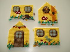 four small houses made out of perler beads