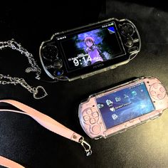 a cell phone sitting on top of a table next to a lanyard and a chain