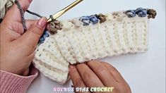 someone is crocheting the edge of a sweater