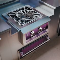 a stainless steel stove top with two burners and a grill grate on the side