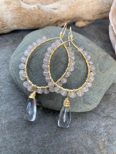 Sweet gemstone beaded hoop earrings .. crafted with hand forged gold tone hoops with hand wire wrapped Rose Quartz gemstones accented with hand wire wrapped clear Quartz gemstones . These beauties measure 3 inches in length . Wire Wrapped Rose Gold Hoop Jewelry, Rose Gold Wire Wrapped Hoop Jewelry, Rose Gold Wire Wrapped Hoop Earrings, Wire Wrapped Beaded Hoop Earrings Gift, Hoop Beaded Earrings Wire Wrapped As Gift, Gift Beaded Hoop Earrings Wire Wrapped, Handmade Rose Gold Teardrop Hoop Earrings, Hand Wrapped Dangle Hoop Earrings As Gift, Gold Wire Wrapped Hoop Crystal Earrings